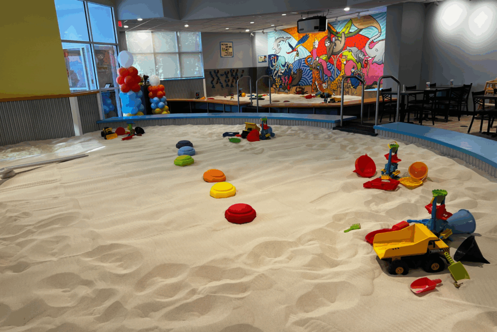 Overall Sandmagination indoor sandbox space filled with beautiful toys